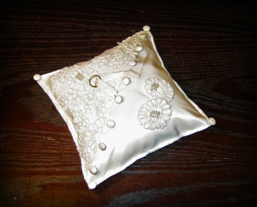 Wedding ring pillow made from the wedding dresses of the bride's and groom's mothers.